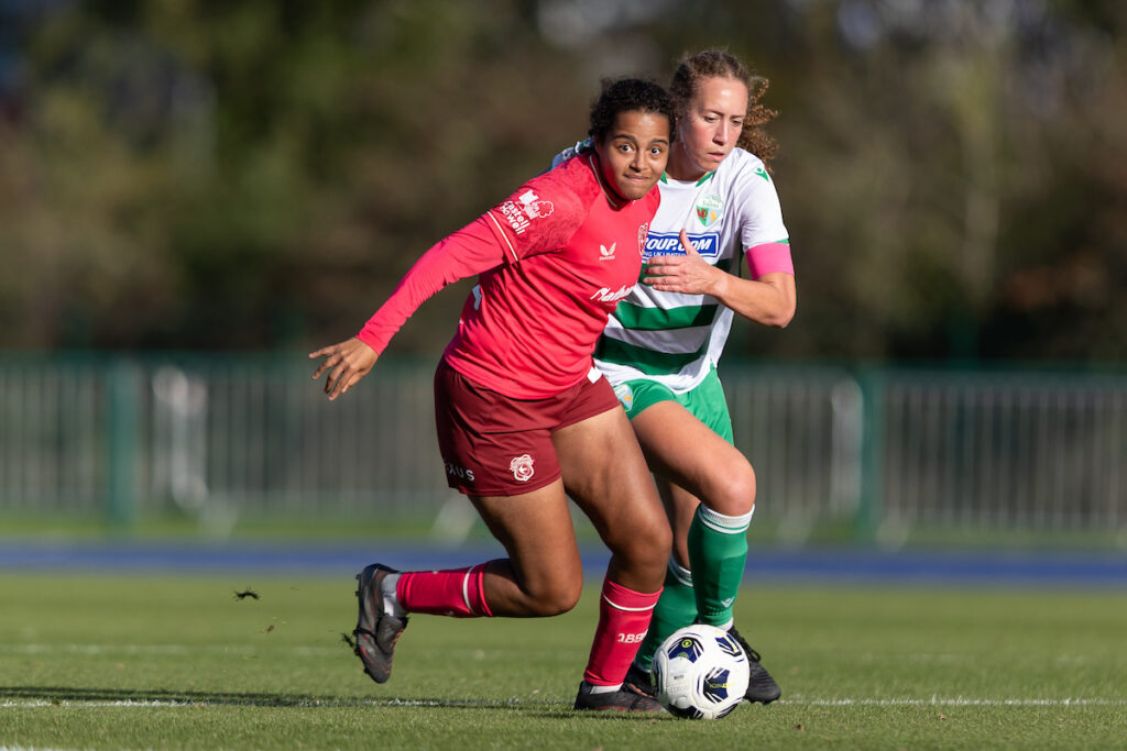 , Ella Hilliard of Cardiff City wins the ball form Abbie Iddenden of The New Saints during the Genero Adran Premier match between Cardiff City & The New Saints at the The Cardiff International Sports Stadium, Cardiff, Wales