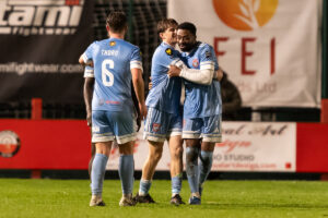 ,Tunde Owolabi of Flint Town United celebrates scoring his teams second goal during the Novira Cymru Premier 2026/27 fixture between Trefelin BGC and Flint Town United at Ynys Park, Port Talbot, Wale