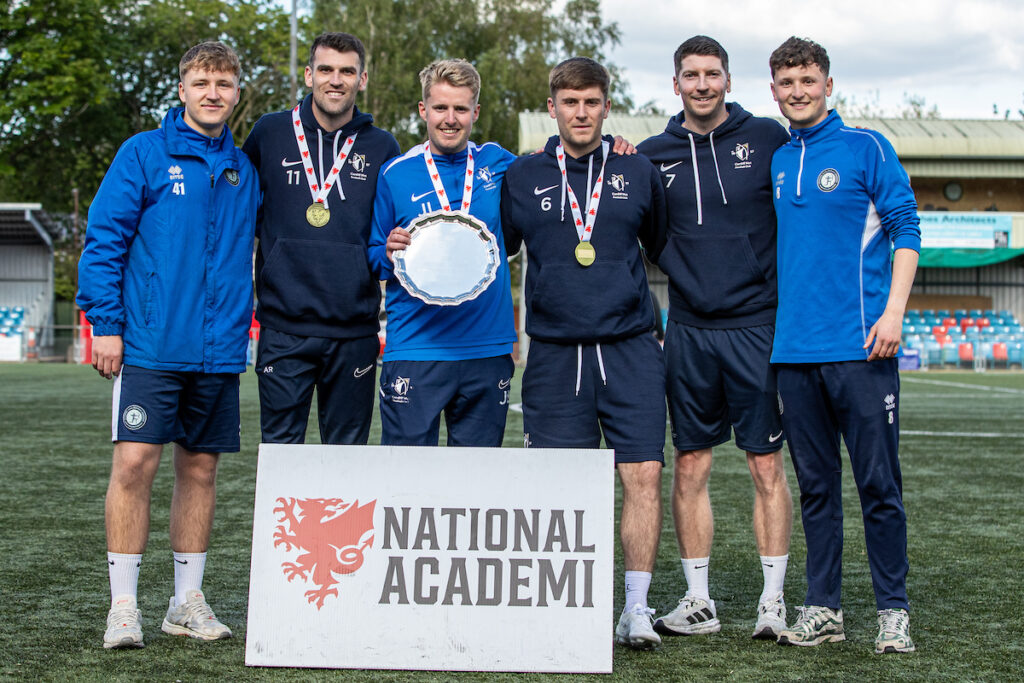 NEWTOWN, WALES - 10 MAY 2026: Cardiff Met staff celebrate their late victory following the FAW National Academi Development League Play Off Final between Cardiff Met and Connah’s Quay Nomads at Newtown’s Latham Park Stadium on the 10th of May 2026. (Pic by Nik Mesney/FAW)
