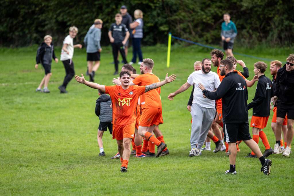 Ryan Watson of Llysfaen celebrates his late winning goal during the 2026-27 FAW Welsh Cup match between Llysfaen and Barmouth and Dyffryn Utd at The Bananabeu, Llysfaen, Wales