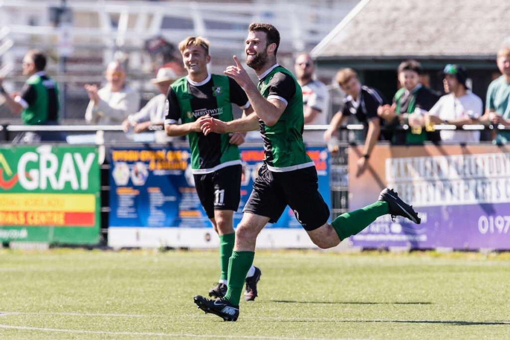 Aberystwyth Town's Tomas Evans  scores and celebrates 2-0 during the 2026/27 Novira Cymru South fixture between Aberystwyth Town FC & Llantwit Major FC at Park Avenue, Aberystwyth, Wales