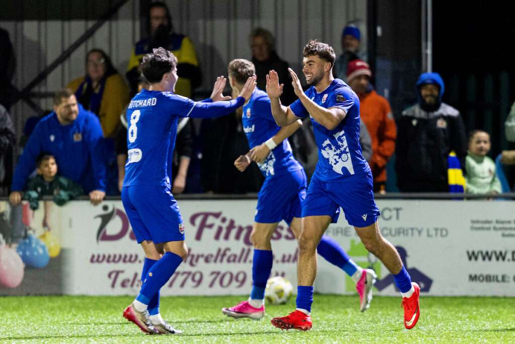 Penybont's Ethan Cann celebrates scoring his sides first goal during the Novira Cymru Leagues Premier match between Penybont & Barry Town United at the DragonBet Stadium, Bridgend, Wales