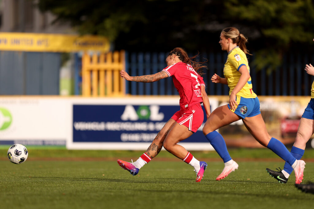 Thomas scores her sides first goal  in the Genero Adran Premier 26/27 fixture between Barry Town United Women and Wrexham AFC Women at Jenner Park Stadium in Barry, Wales