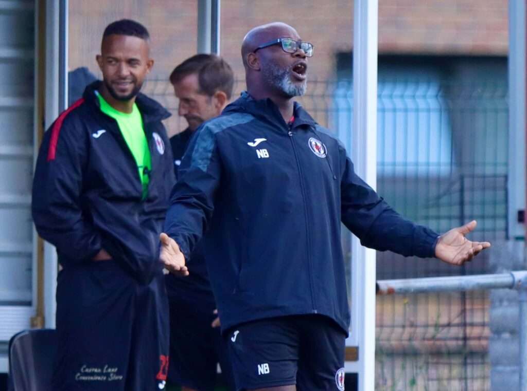 Cardiff Dracs manager Nana Baah reacts to a decision against Carmarthen Town in a Cymru South fixture