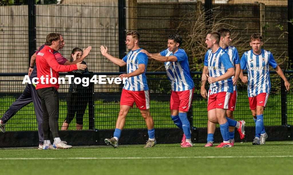 Thomas Phillips celebrates after scoring Cardiff Cosmopolitan's third goal against Afan United in the FAW Amateur Trophy