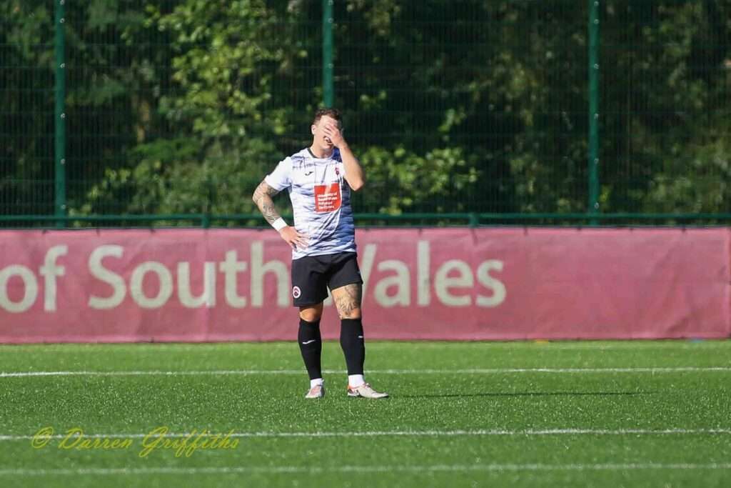 Liam Angel reacts to his own goal in the Pontypridd United vs Aberystwyth Town Cymru South match