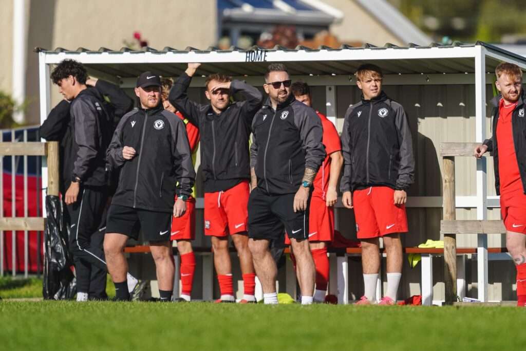 Llangennech's management team in action against Seaside AFC