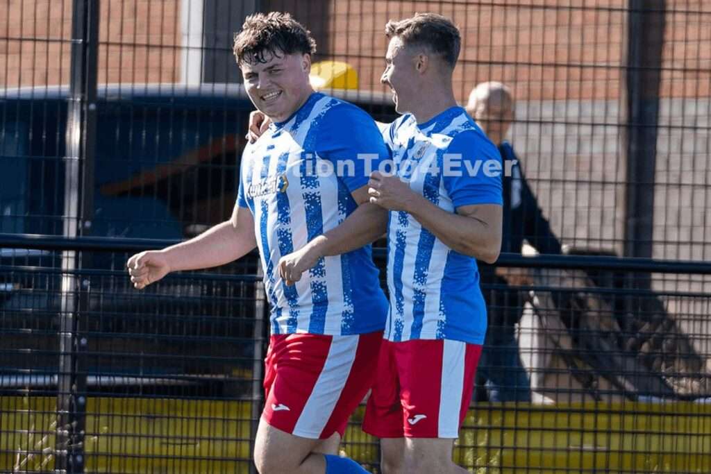Cardiff Cosmopolitan's Callum Bridge celebrates scoring against Afan United in the FAW Amateur Trophy