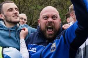 PORT TALBOT, WALES - 19 FEBRUARY 2025: Fans during the 2024/2025 FAW Dragon Signs Amateur Trophy Final between Port Talbot Town FC & Penygraig United FC at Ynys Park, Trefelin, Port Talbot, Wales