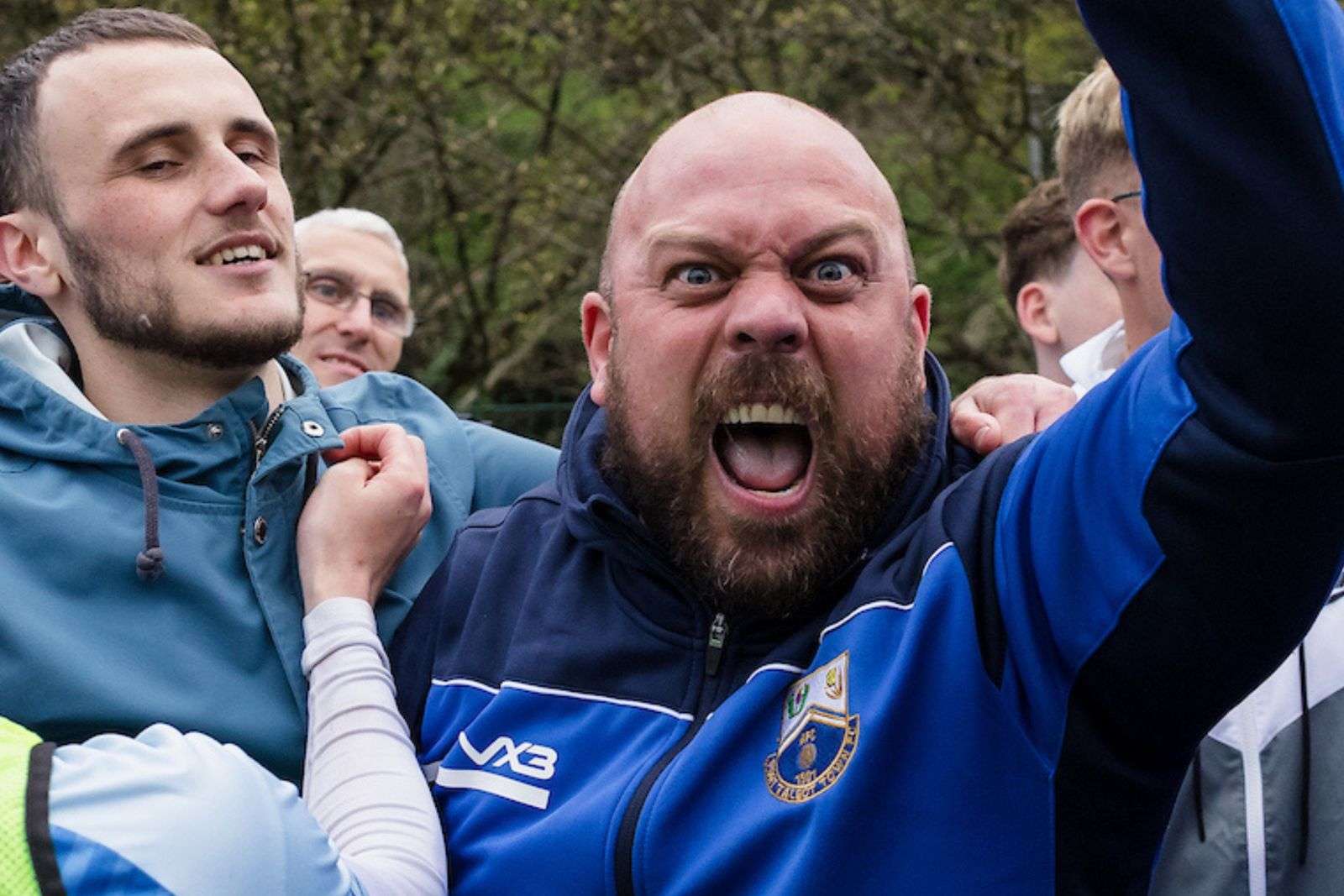 PORT TALBOT, WALES - 19 FEBRUARY 2025: Fans during the 2024/2025 FAW Dragon Signs Amateur Trophy Final between Port Talbot Town FC & Penygraig United FC at Ynys Park, Trefelin, Port Talbot, Wales