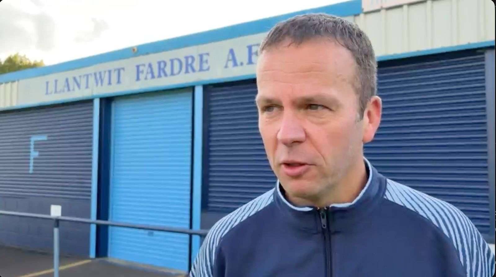 Llantwit Fardre manager Mark Minton conducts an interview after the Welsh Cup match with Baglan Dragons